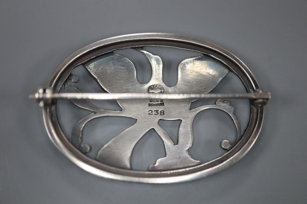 A Georg Jensen sterling Bird of Paradise oval brooch, designed by Arno Malinowski, no. 238, 44mm, 10 grams.